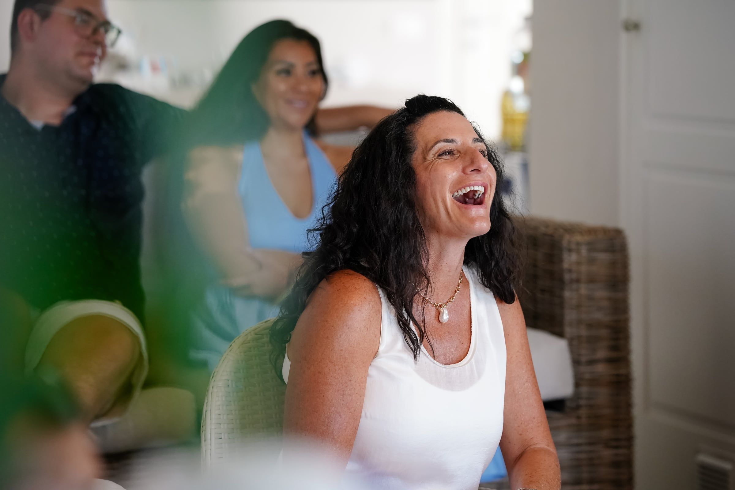 A woman laughing during a group session at the retreat