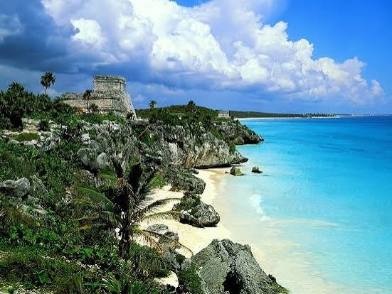 Mayan ruins above a sandy beach in Tulum, Mexico