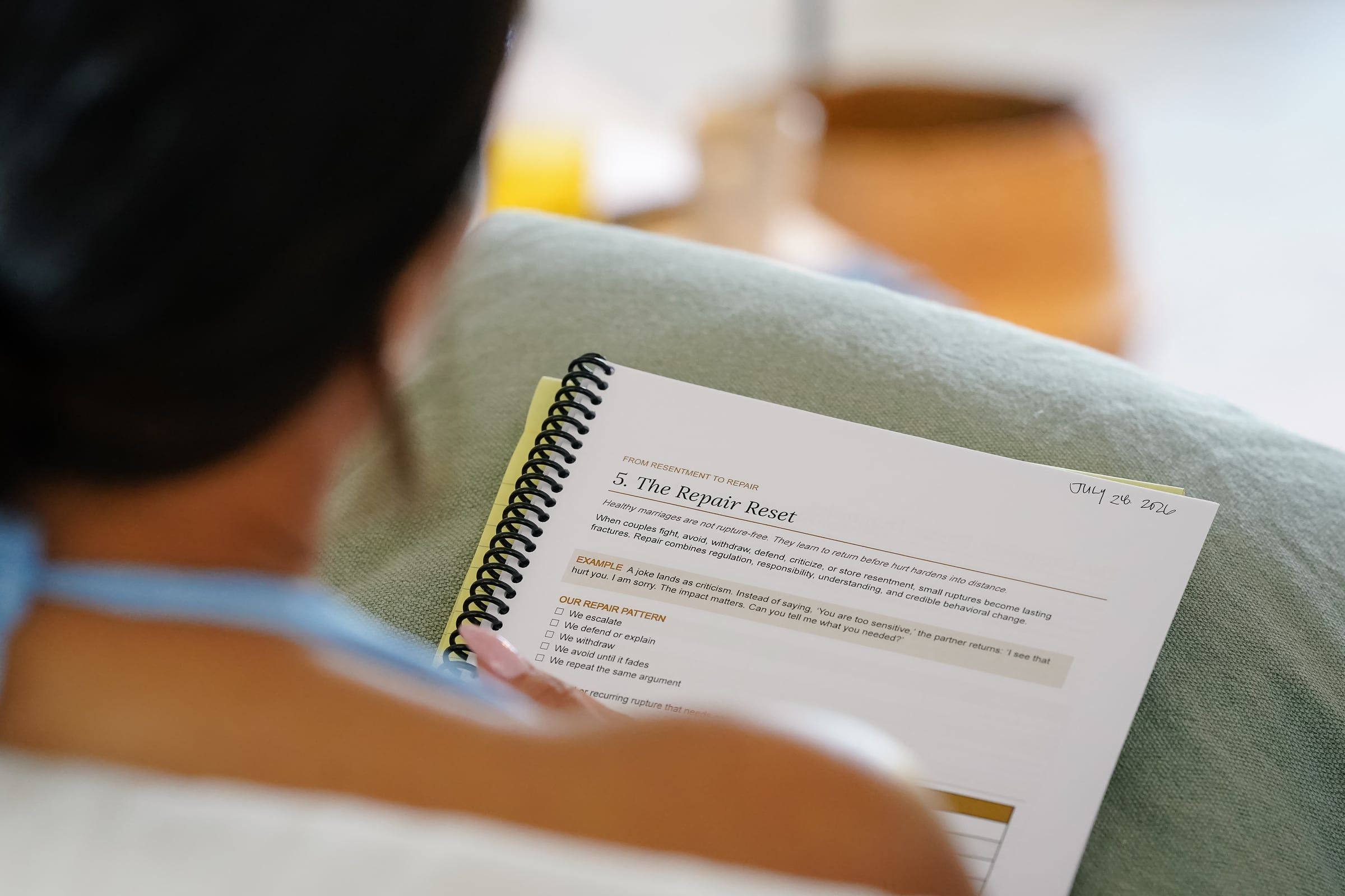 The Freedom Code for Couples workbook, open during a session
